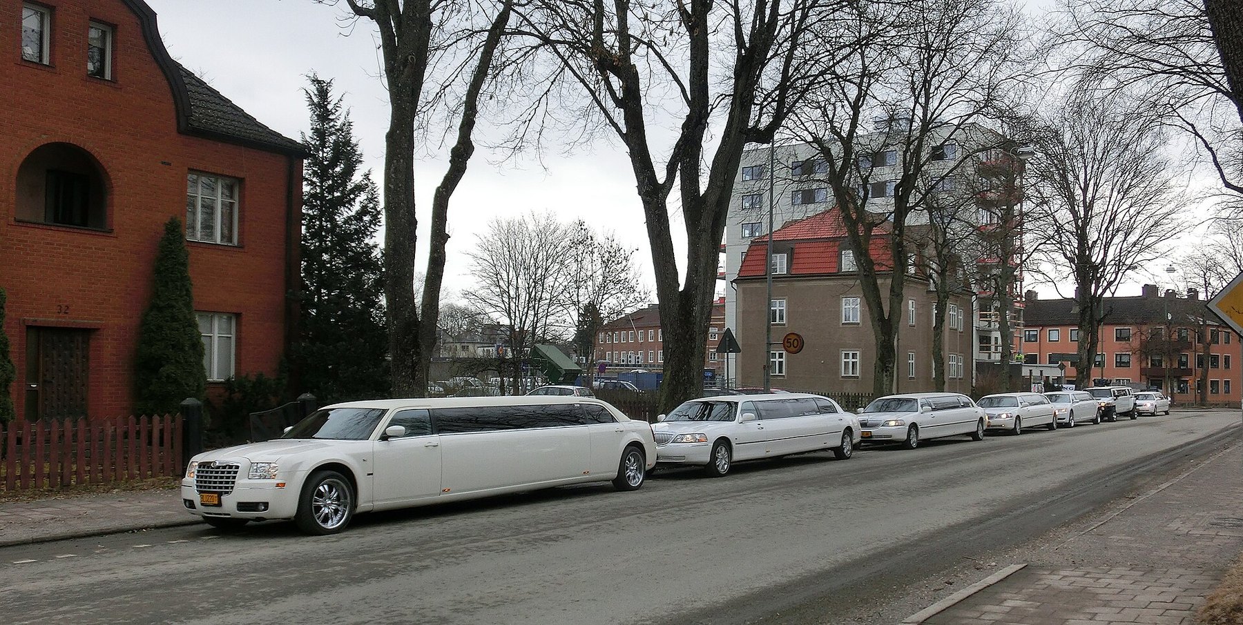 White stretch limousine on an urban street